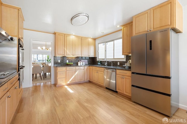 kitchen featuring appliances with stainless steel finishes and light brown cabinetry