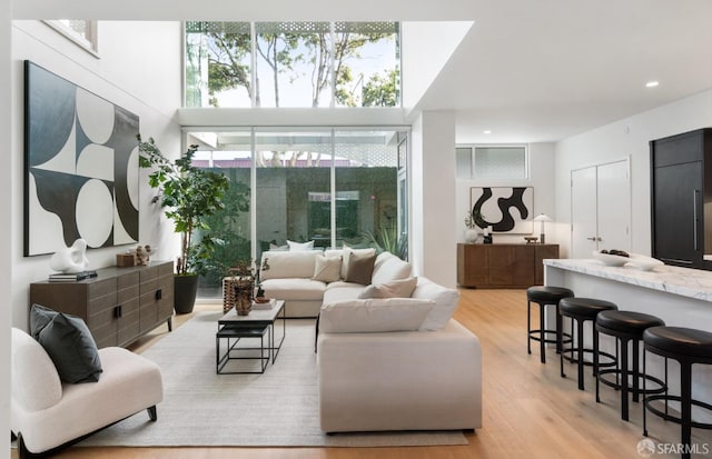 living room with recessed lighting and light wood finished floors