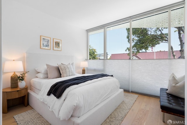 bedroom featuring wood finished floors