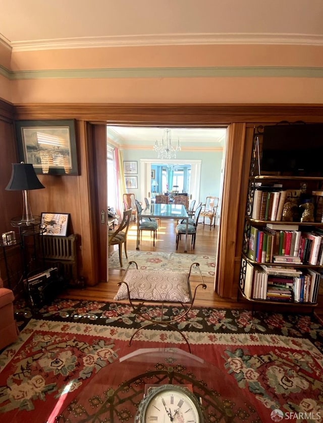 2299 Sacramento St Unit 15, San Francisco, CA 94115 - living area with wood finished floors, crown molding, and a chandelier