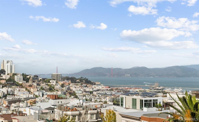 city view featuring a water and mountain view