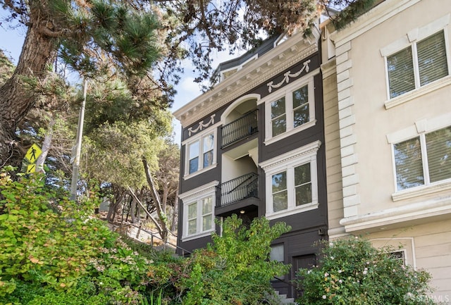 view of property exterior featuring a balcony