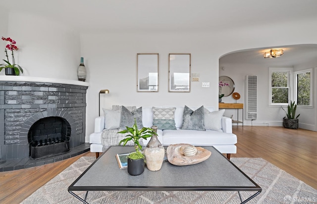 living room featuring a fireplace and hardwood / wood-style flooring