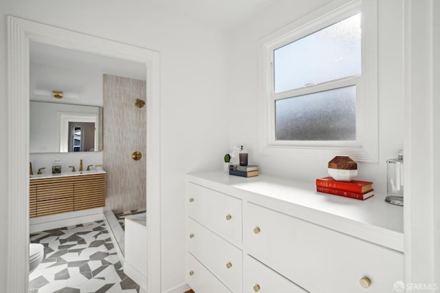 bathroom featuring vanity and toilet