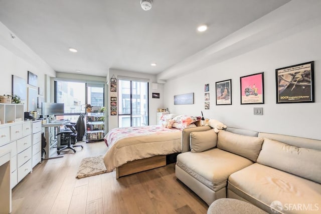 bedroom featuring light wood-type flooring, access to outside, and recessed lighting