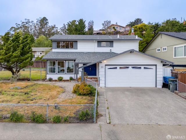 traditional home featuring roof with shingles, fence private yard, driveway, and a garage