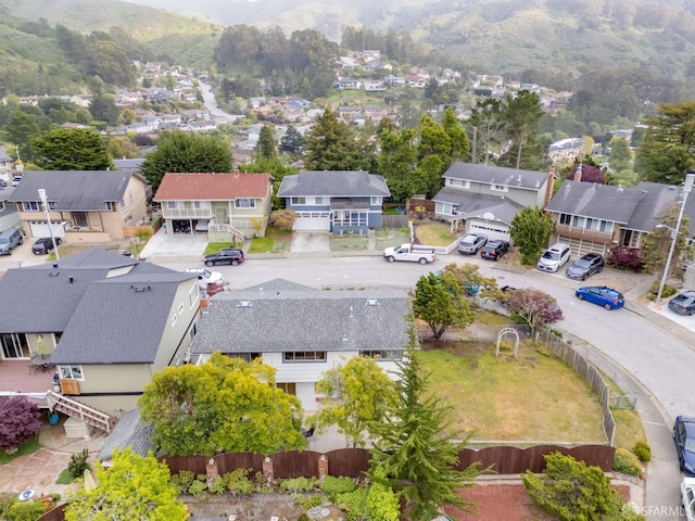 birds eye view of property featuring a mountain view and a residential view