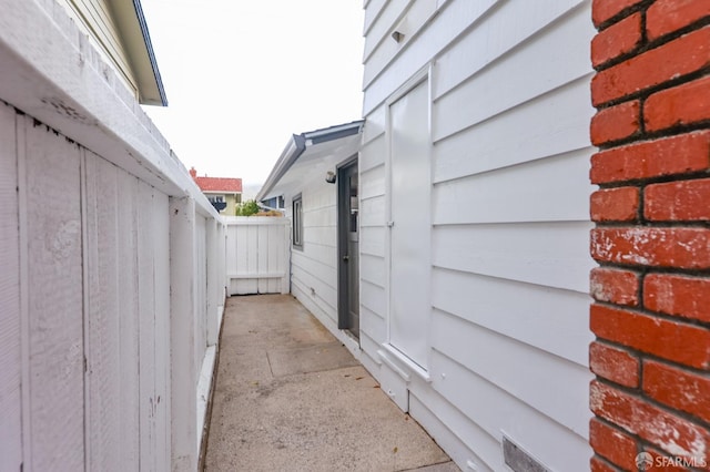view of home's exterior with fence