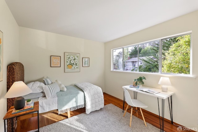 bedroom with wood finished floors