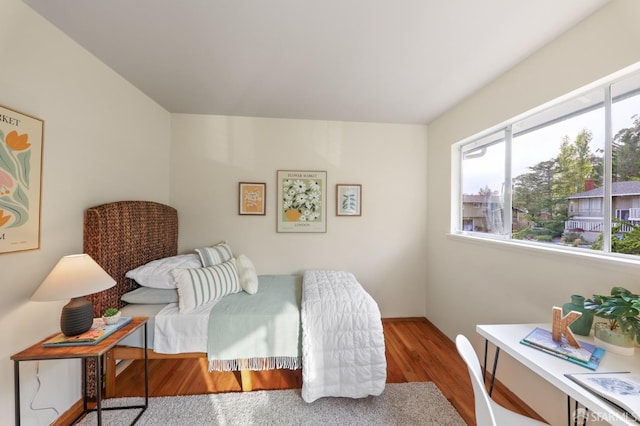bedroom with wood finished floors
