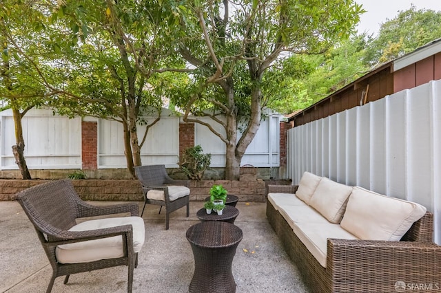 view of patio with a fenced backyard and an outdoor hangout area