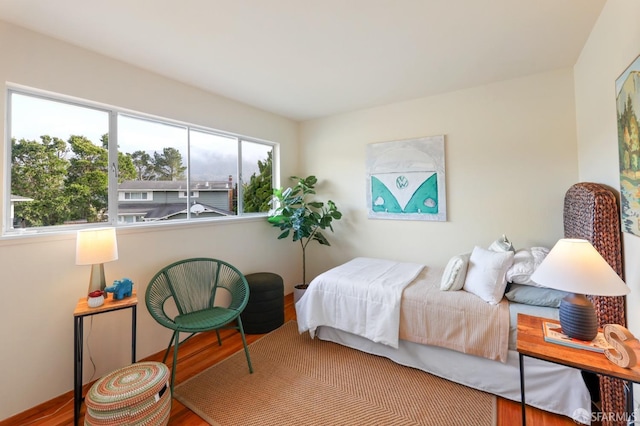 bedroom with wood finished floors