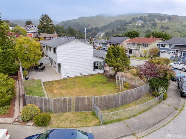 birds eye view of property featuring a mountain view and a residential view