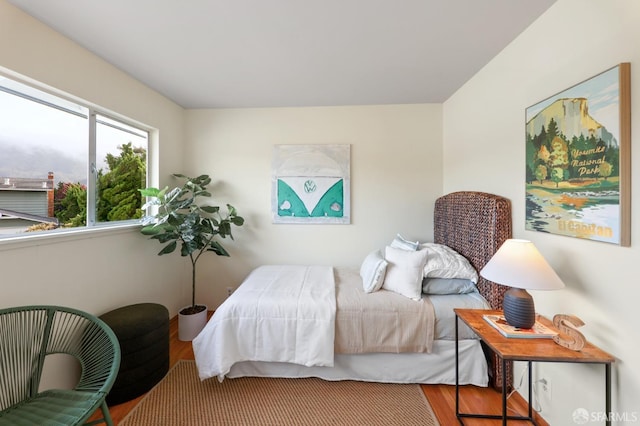 bedroom with wood finished floors
