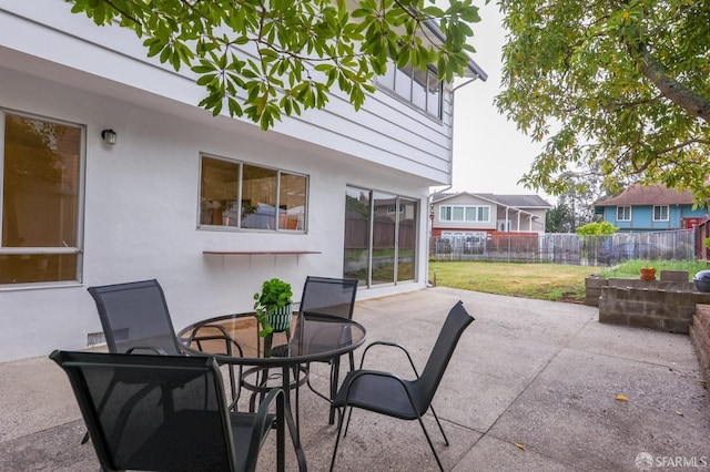 view of patio / terrace with fence and outdoor dining space