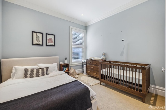 bedroom featuring crown molding and carpet