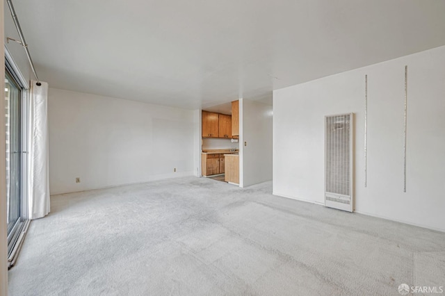 1455 Laguna St Unit 6, San Francisco, CA 94115 - spare room featuring a heating unit and light colored carpet
