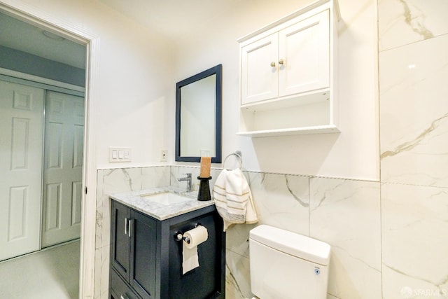 19652 Stanton Ave, Castro Valley, CA 94546 - bathroom with tile walls, vanity, and a wainscoted wall