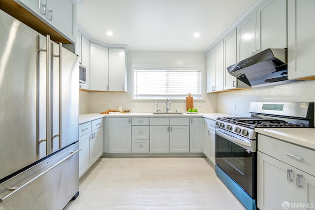 19652 Stanton Ave, Castro Valley, CA 94546 - kitchen with stainless steel appliances, ventilation hood, light countertops, recessed lighting, and light wood-style floors
