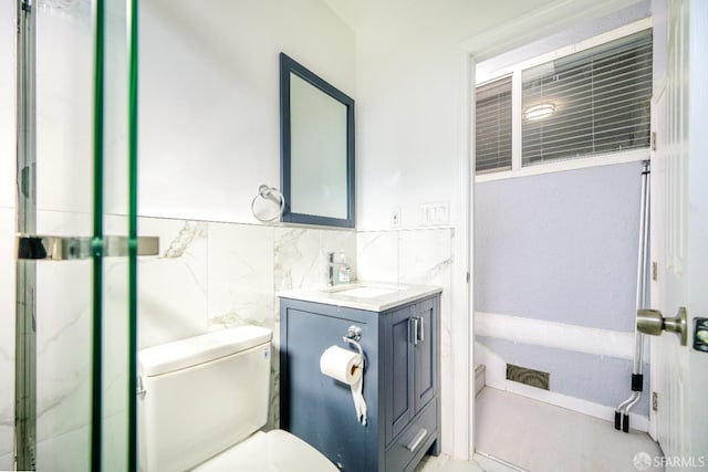 19652 Stanton Ave, Castro Valley, CA 94546 - full bath with vanity, tile walls, a wainscoted wall, and a shower with door