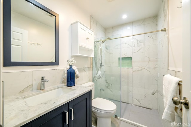 19652 Stanton Ave, Castro Valley, CA 94546 - bathroom featuring a marble finish shower, vanity, tile walls, and recessed lighting
