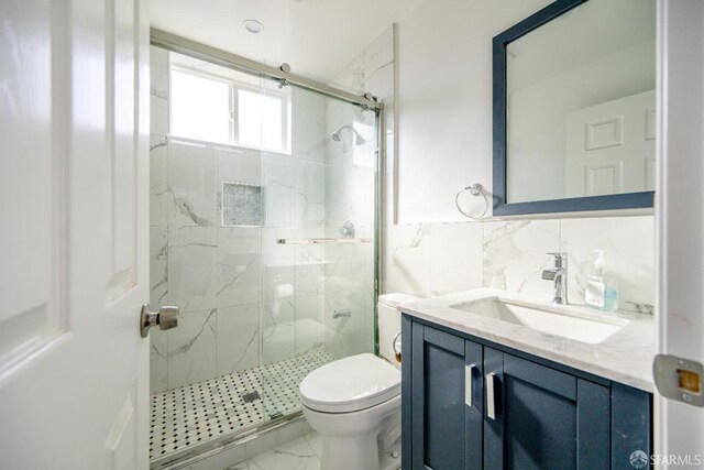 19652 Stanton Ave, Castro Valley, CA 94546 - bathroom featuring a marble finish shower, vanity, marble look tile flooring, and tile walls