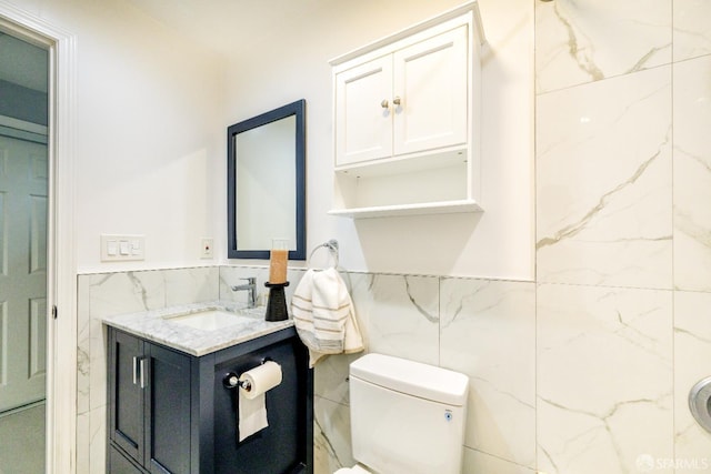 19652 Stanton Ave, Castro Valley, CA 94546 - bathroom with tile walls, vanity, and wainscoting
