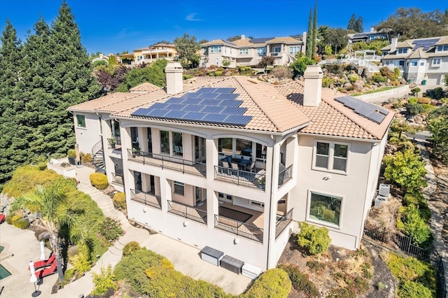 back of property with solar panels