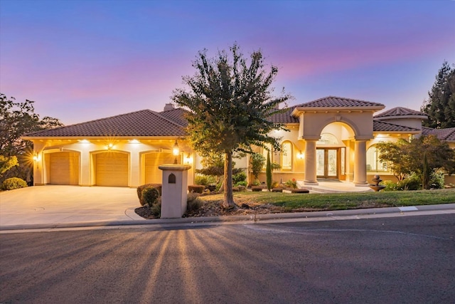 mediterranean / spanish-style house featuring a garage