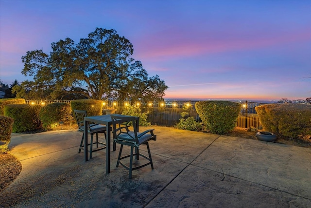 view of patio terrace at dusk