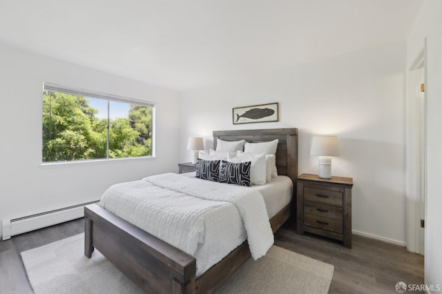 134 Albatross Ct, San Francisco, CA 94124 - bedroom featuring a baseboard heating unit, wood finished floors, and baseboards