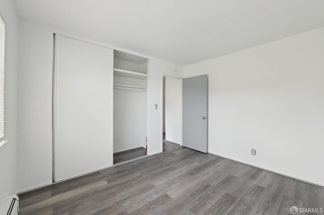 134 Albatross Ct, San Francisco, CA 94124 - unfurnished bedroom with baseboard heating, wood finished floors, and a closet
