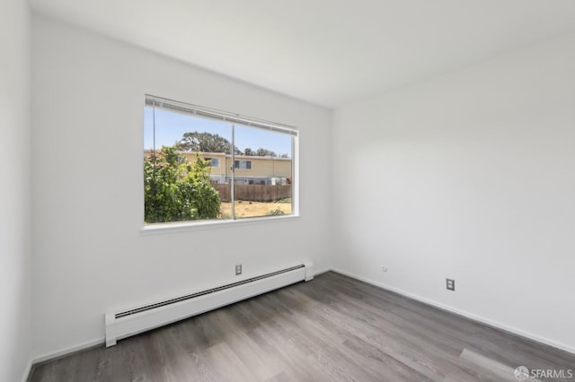134 Albatross Ct, San Francisco, CA 94124 - empty room featuring a baseboard radiator, wood finished floors, and baseboards