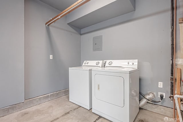 clothes washing area featuring independent washer and dryer, laundry area, and electric panel