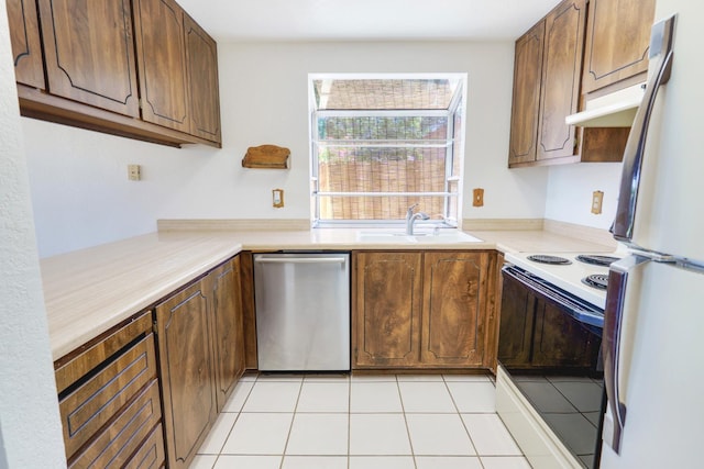 8467 Country Greens Ct, Sacramento, CA 95828 - kitchen featuring white appliances, a sink, under cabinet range hood, light tile patterned floors, and light countertops