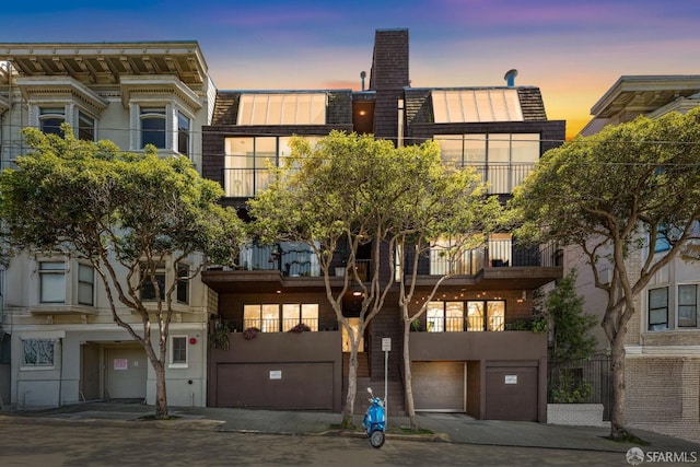 2171 Sacramento St Unit 4, San Francisco, CA 94109 - view of front of property with a garage, a chimney, and stucco siding