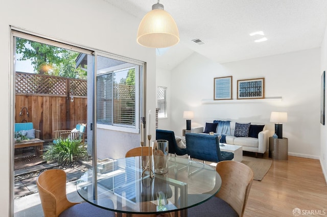 3937 Vine St, Pleasanton, CA 94566 - dining area with healthy amount of natural light, vaulted ceiling, wood finished floors, and baseboards