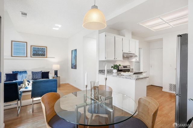 3937 Vine St, Pleasanton, CA 94566 - dining area with light wood-type flooring and baseboards