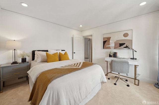 bedroom with recessed lighting, light colored carpet, and baseboards