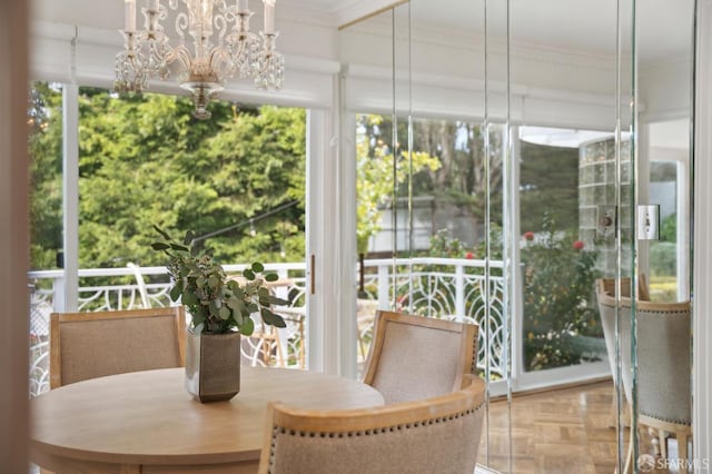 sunroom with an inviting chandelier