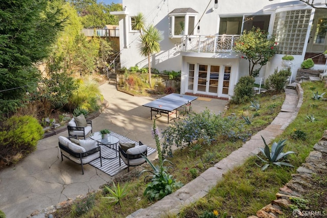 back of property featuring a patio and stucco siding