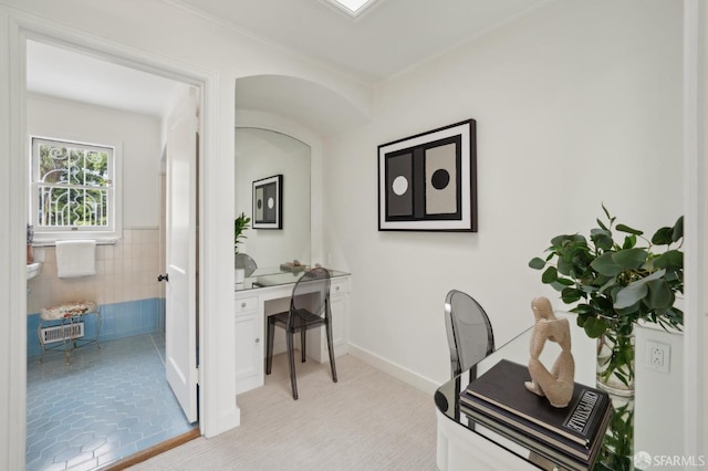 office area featuring wainscoting and tile walls