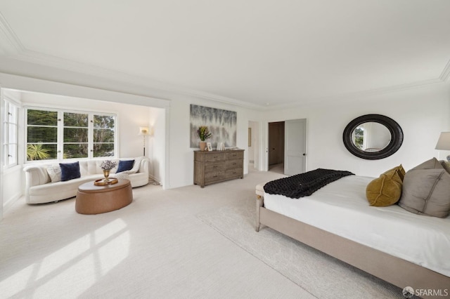 bedroom featuring ornamental molding and carpet flooring