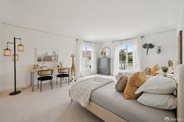 bedroom featuring carpet floors and multiple windows