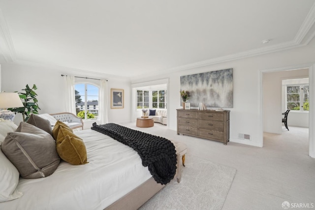 carpeted bedroom with ornamental molding, visible vents, and multiple windows