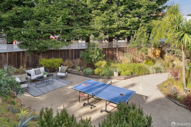 view of patio / terrace featuring fence and an outdoor hangout area