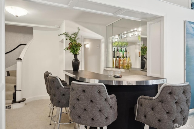 bar featuring baseboards, carpet flooring, stairway, and a dry bar