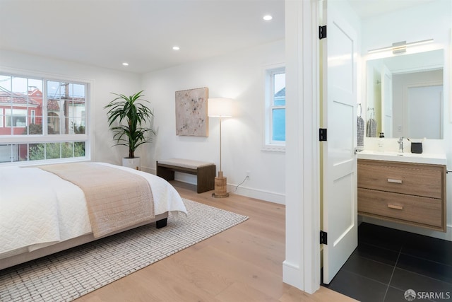 2277 33rd Ave, San Francisco, CA 94116 - bedroom with dark wood finished floors, recessed lighting, and ensuite bathroom
