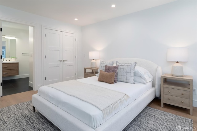 2277 33rd Ave, San Francisco, CA 94116 - bedroom featuring wood finished floors, a closet, recessed lighting, and ensuite bath