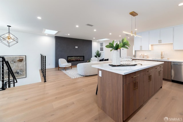 2277 33rd Ave, San Francisco, CA 94116 - kitchen with dishwasher, light wood-type flooring, modern cabinets, a center island, and recessed lighting